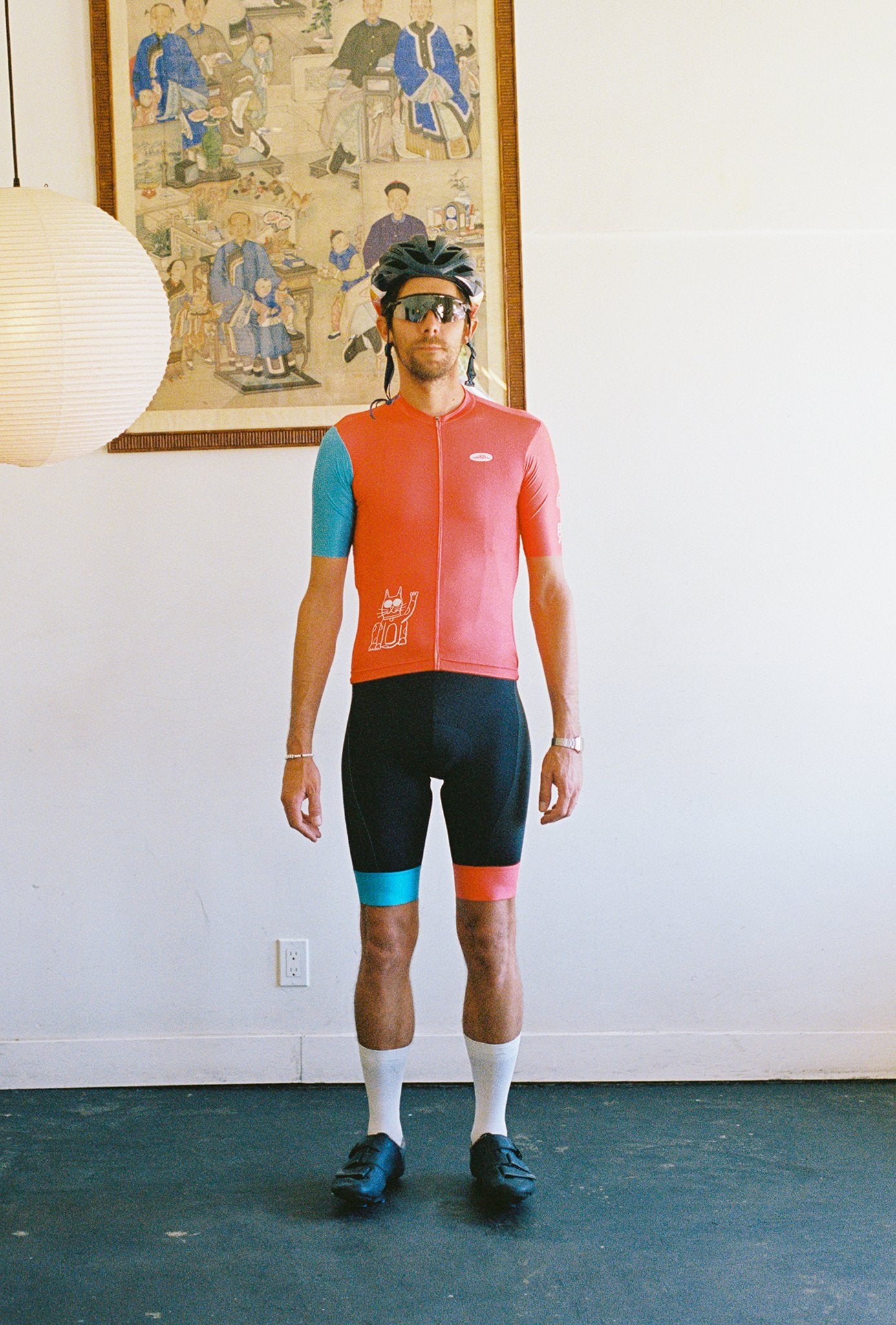 A person wearing a cycling jersey and bib