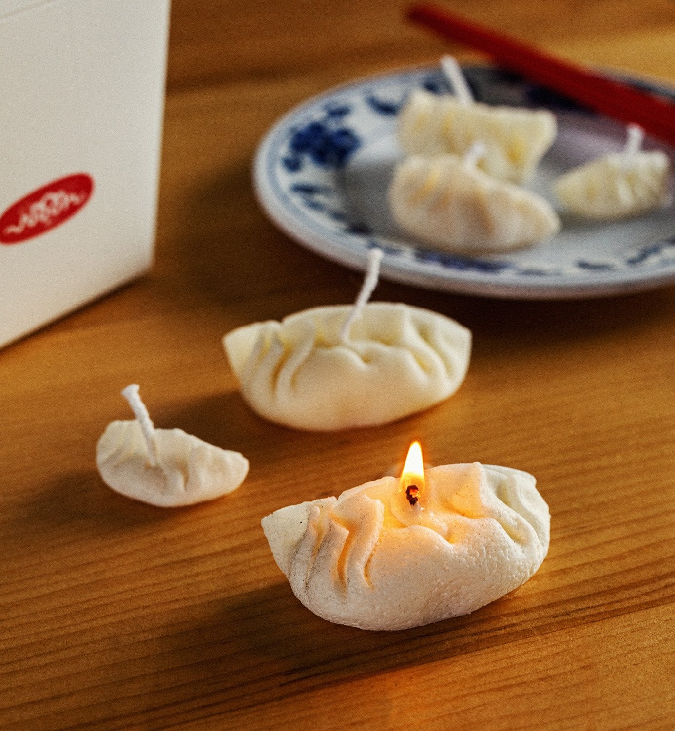 Three dumpling candles, one is lit