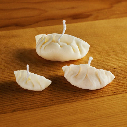 Three dumpling candles