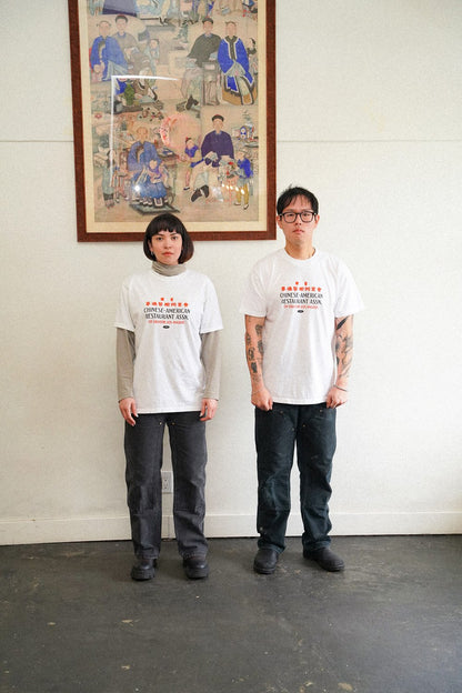 two people wearing white tshirts