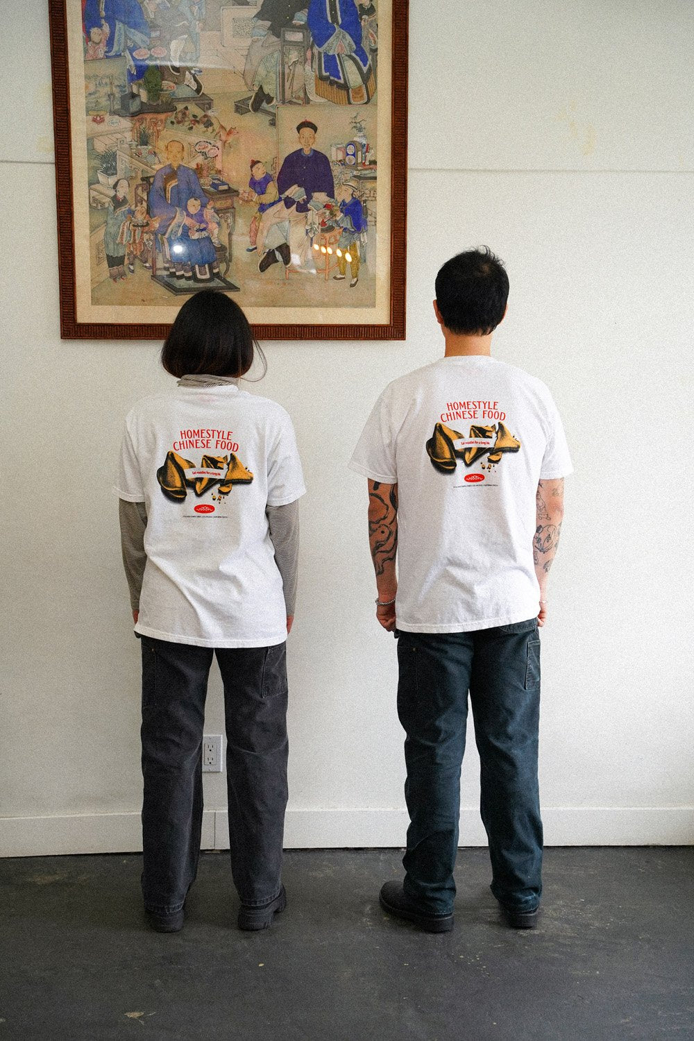 two people wearing white tshirts