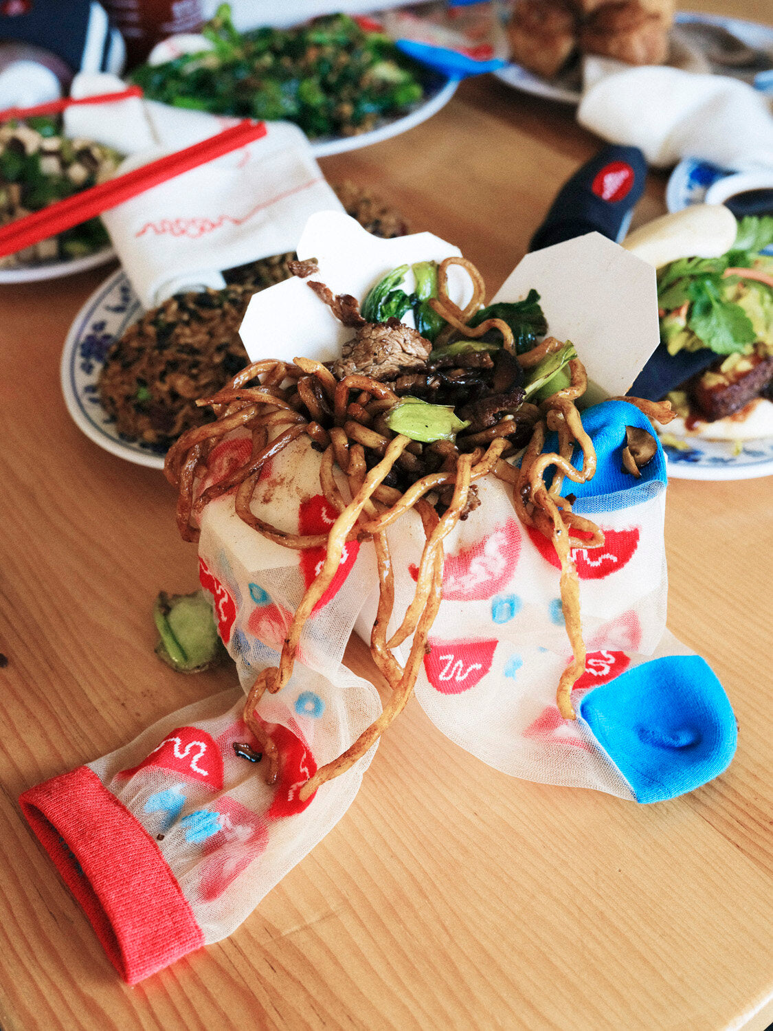 Mesh bowl sock in a take out container with noodles