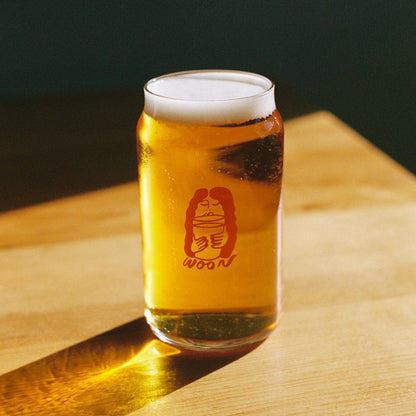 A glass with a woon logo 