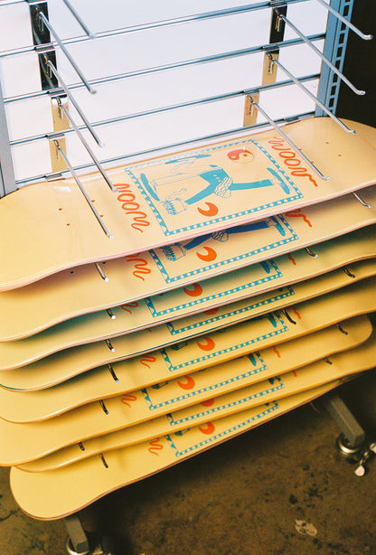 Stack of woon skateboards