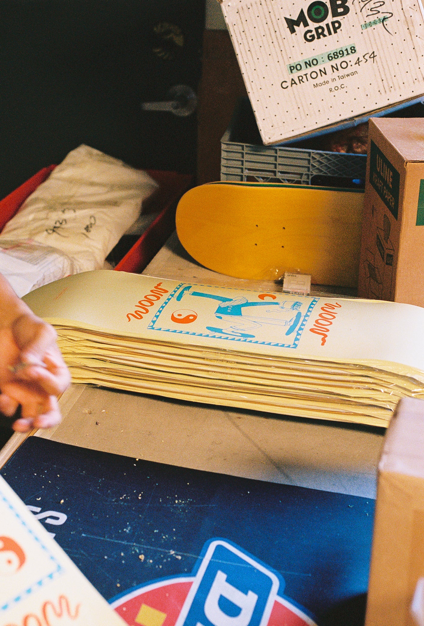 A stack of woon skateboards