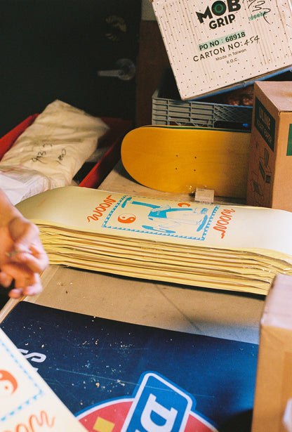 A stack of woon skateboards
