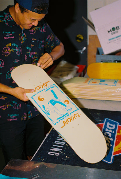 A person shaping a skatebaord