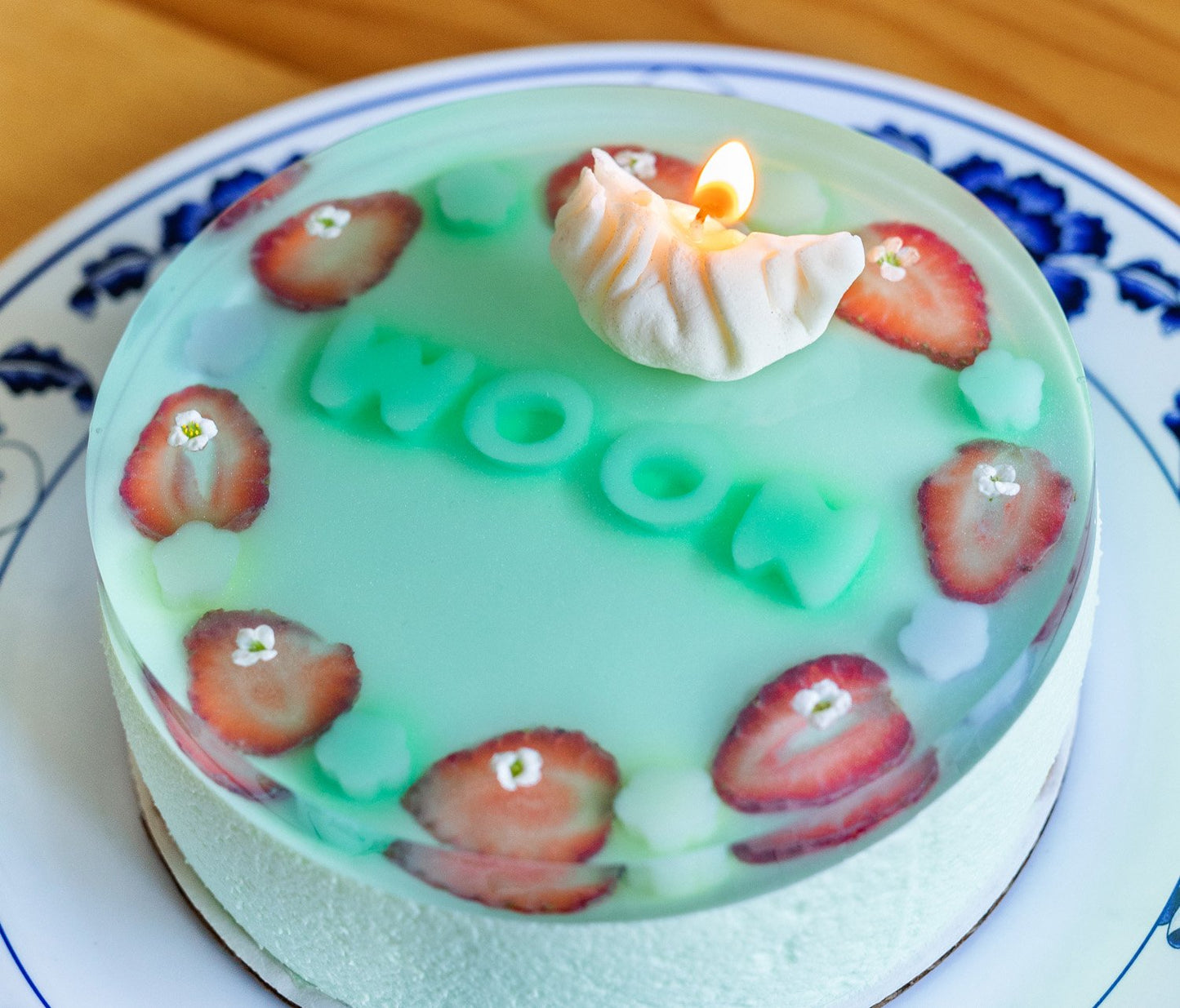 A cake with dumpling candle on it