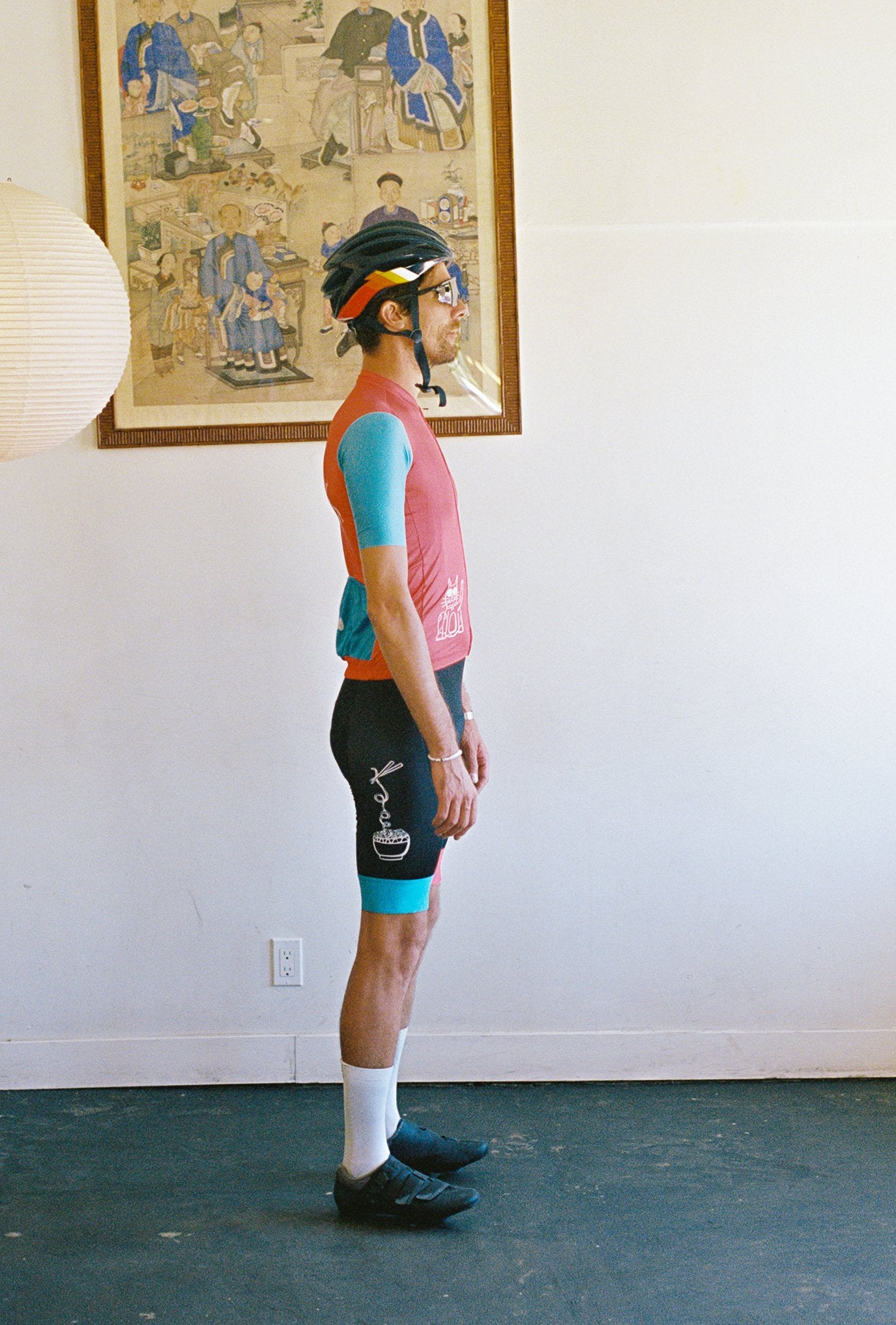 A person wearing a cycling jersey and bib