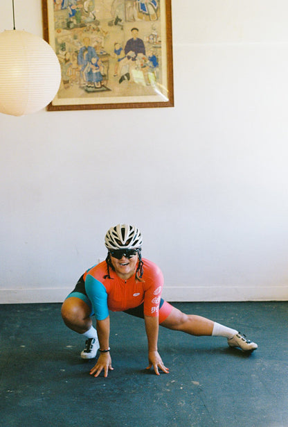 A woman wearing a woon cycling jersey