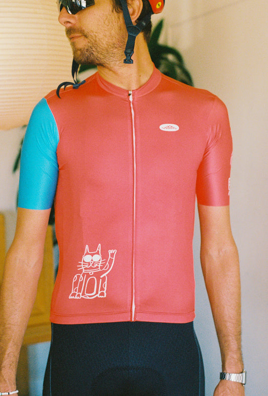 A person wearing a cycling jersey and bib