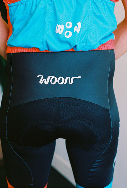 Close up of back of cycling bib with the words Woon