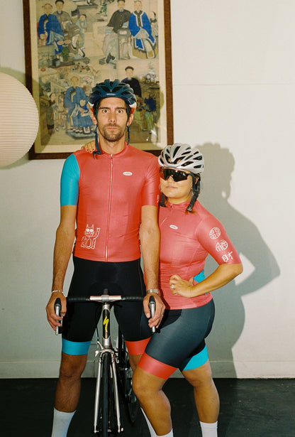 Two people wearing cycling jersey and bibs